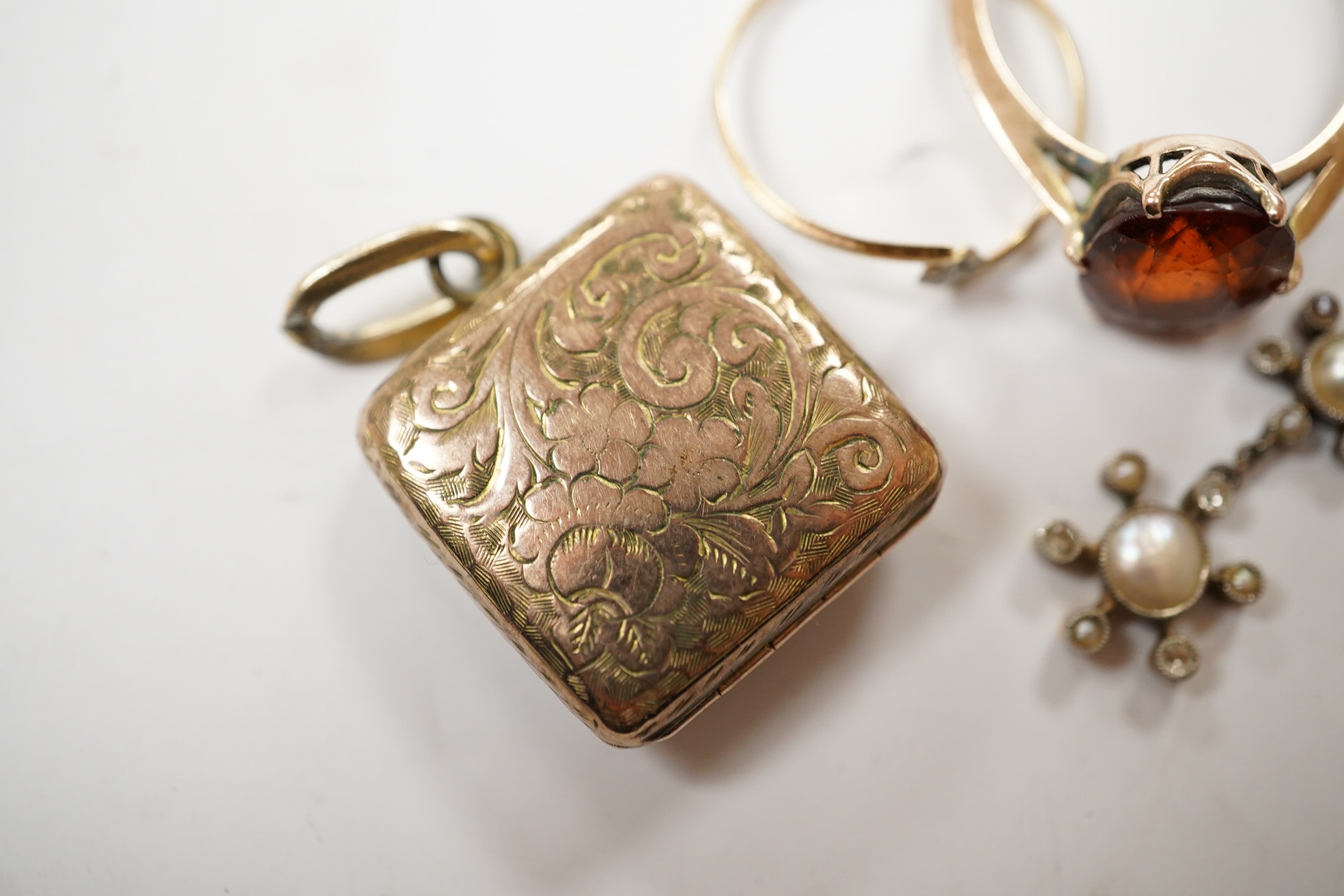 Sundry jewellery including a yellow metal and hessonite garnet set ring, a single yellow metal, seed pearl and diamond cluster set drop earring, locket, cross and a ring. Condition - poor to fair